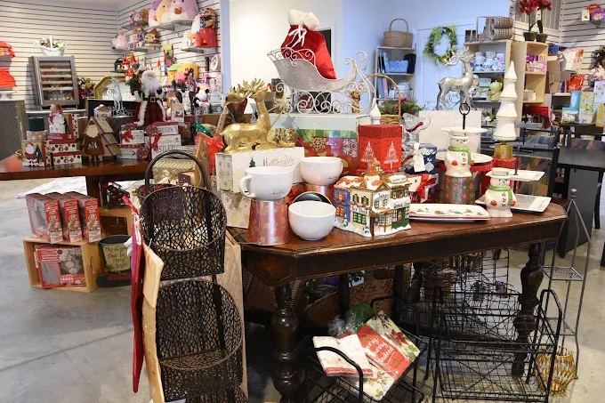 Inside the OHC Gift Co shop, with tables full of curated gifts and seasonal decor